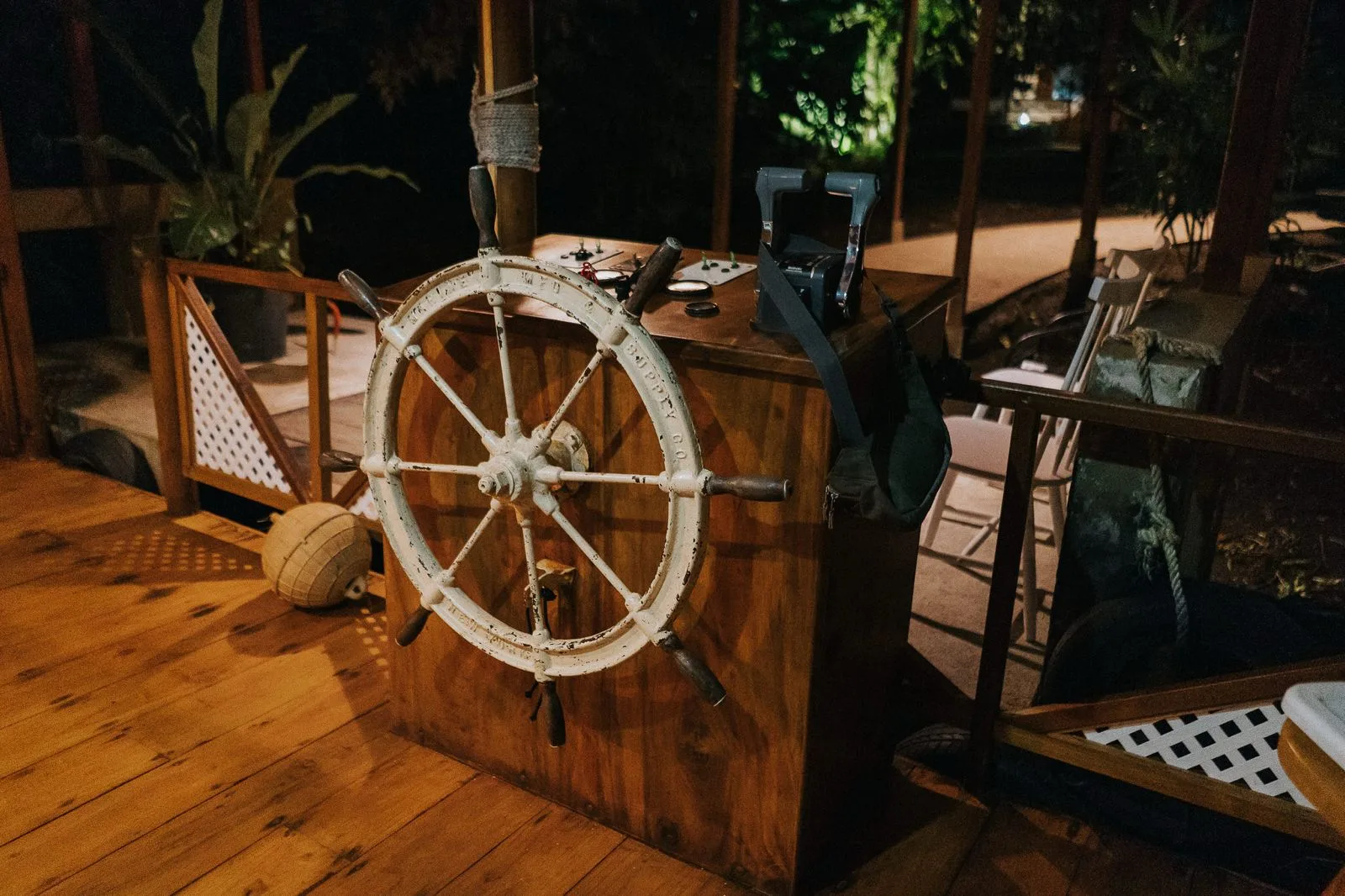 The rescued helm from the original Mawamba boat — the compass that gives the lodge its way